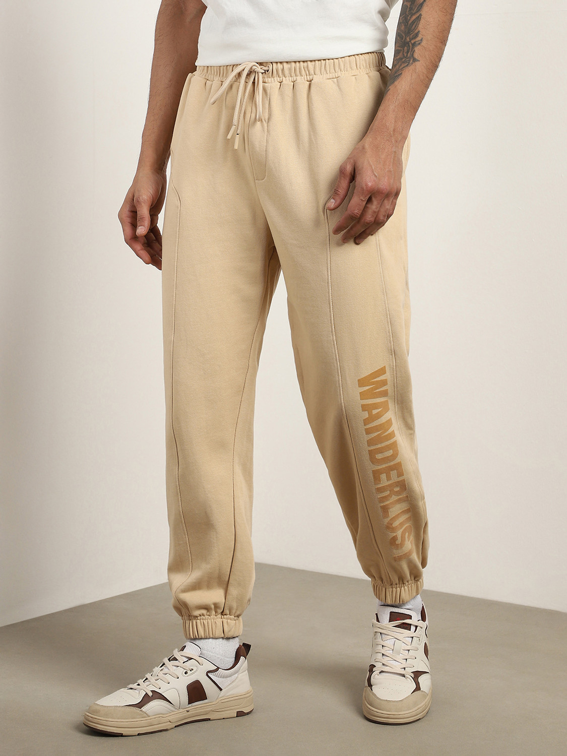 Image of NOBERO Printed Men Beige Track Pants