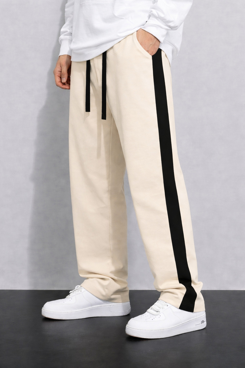 Image of COMBRAIDED Self Design Men Beige, Black Track Pants
