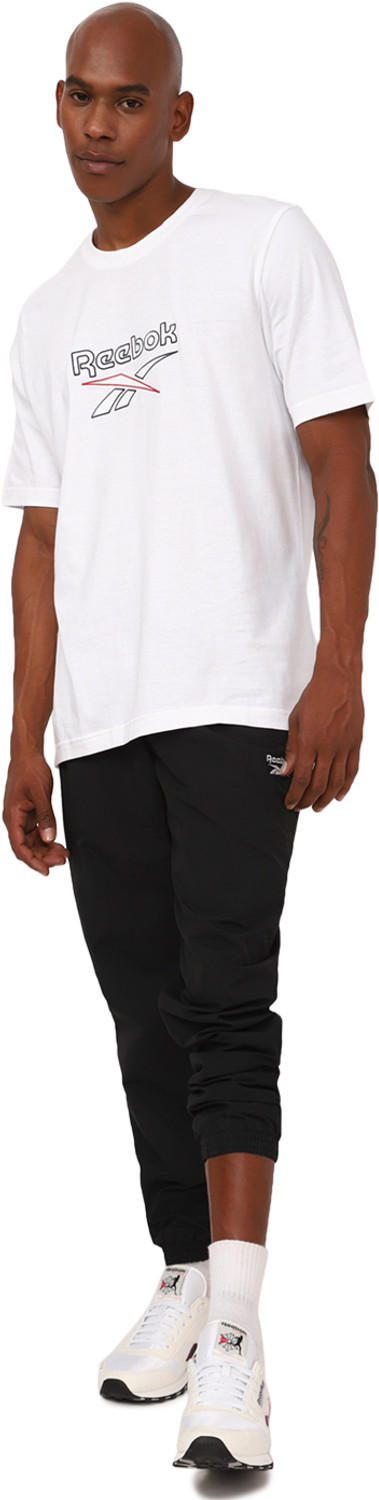 Image of REEBOK Solid Men Black Track Pants
