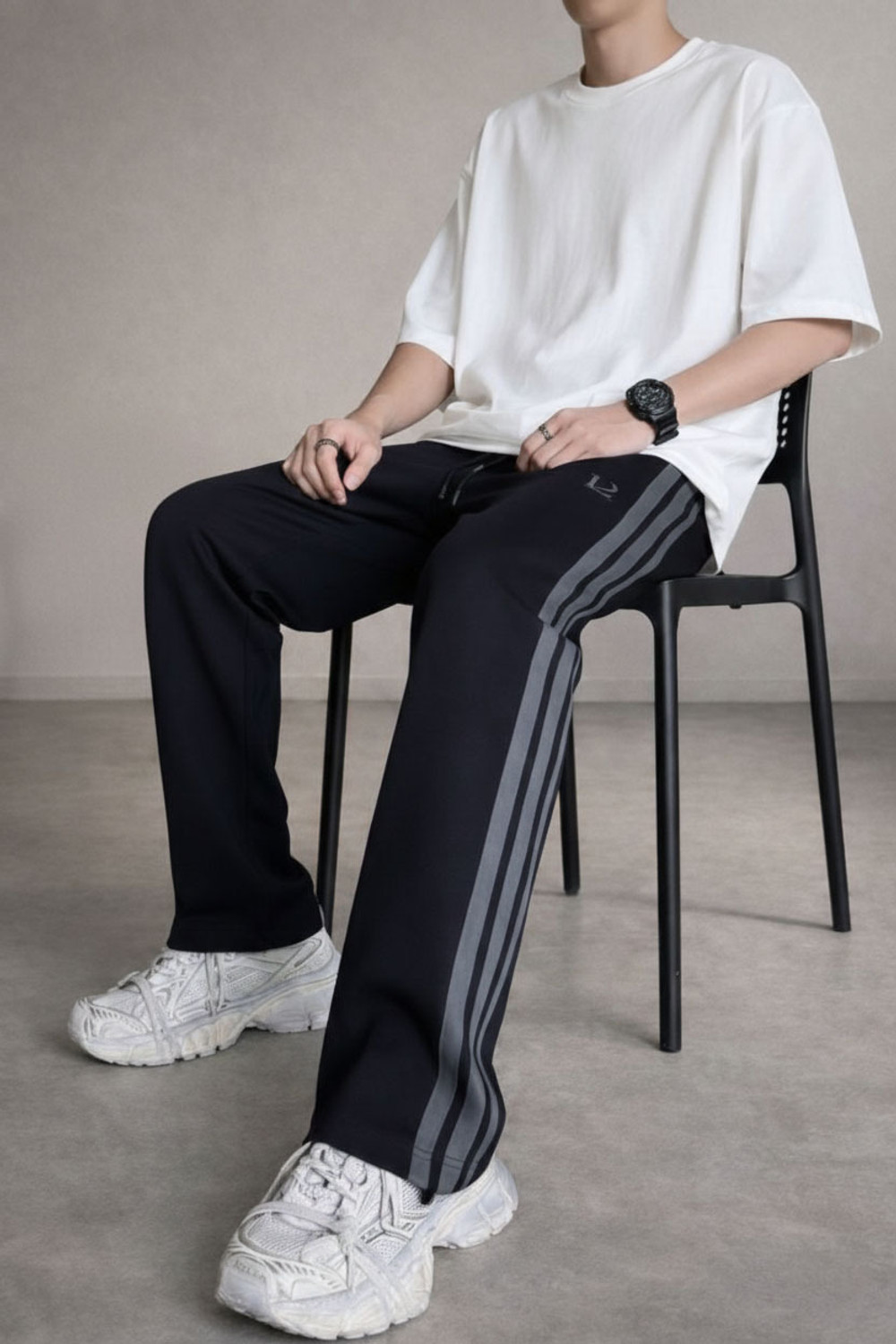 Image of LOTHRIC Striped Men Black Track Pants