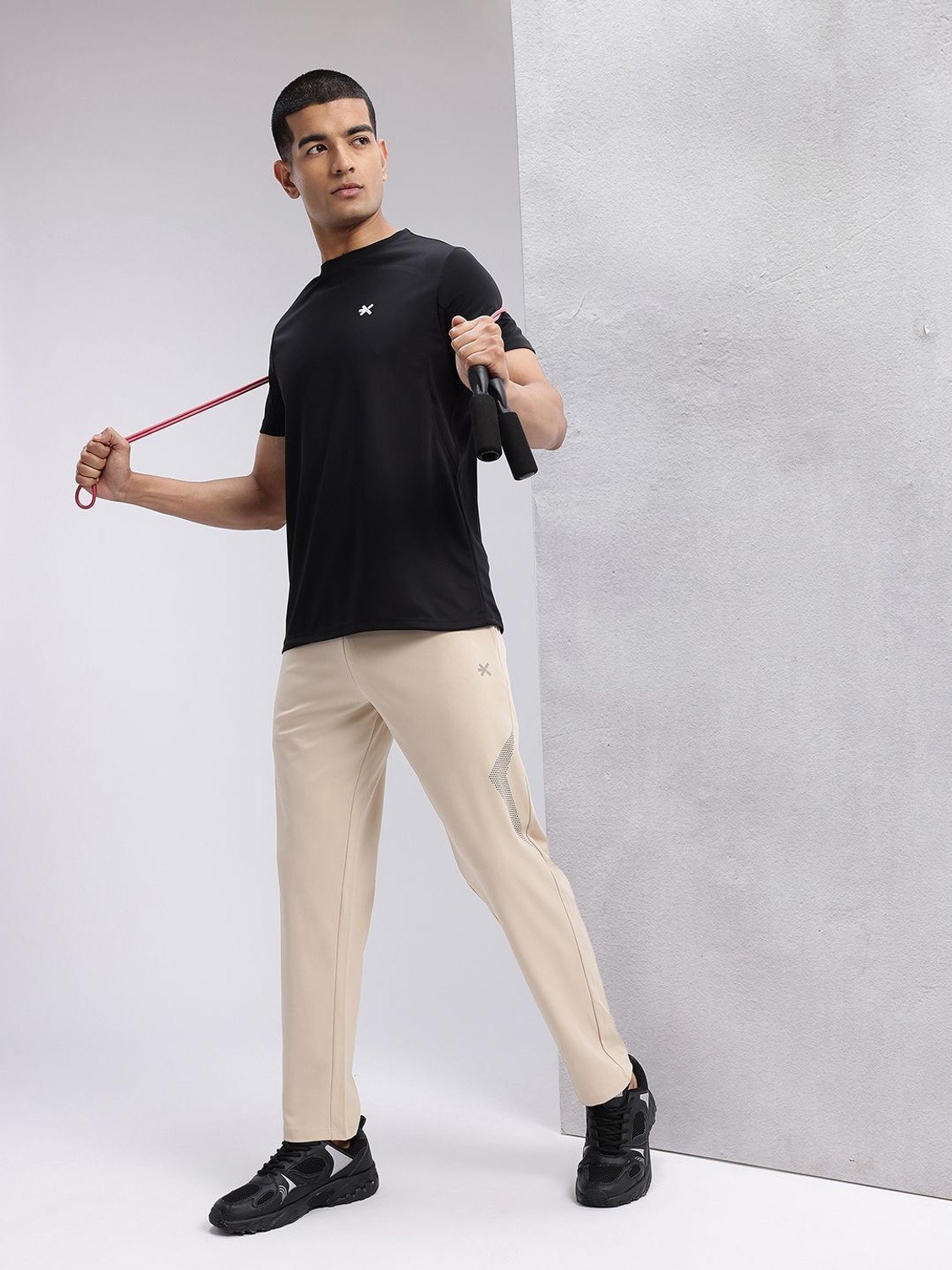 Image of HRX by Hrithik Roshan Graphic Print Men Beige Track Pants