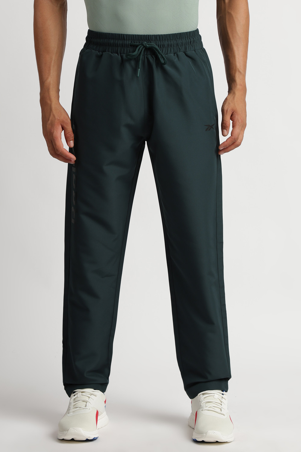 Image of REEBOK Solid Men Dark Green Track Pants