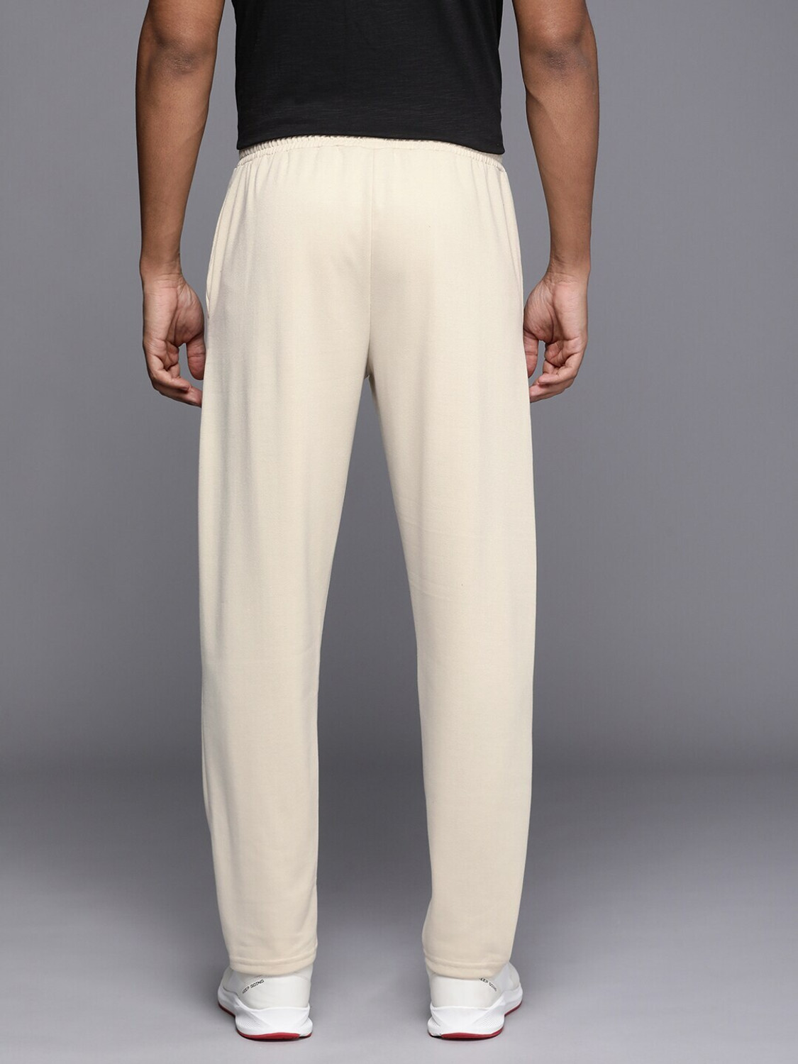 Image of HRX by Hrithik Roshan Self Design Men Gold Track Pants