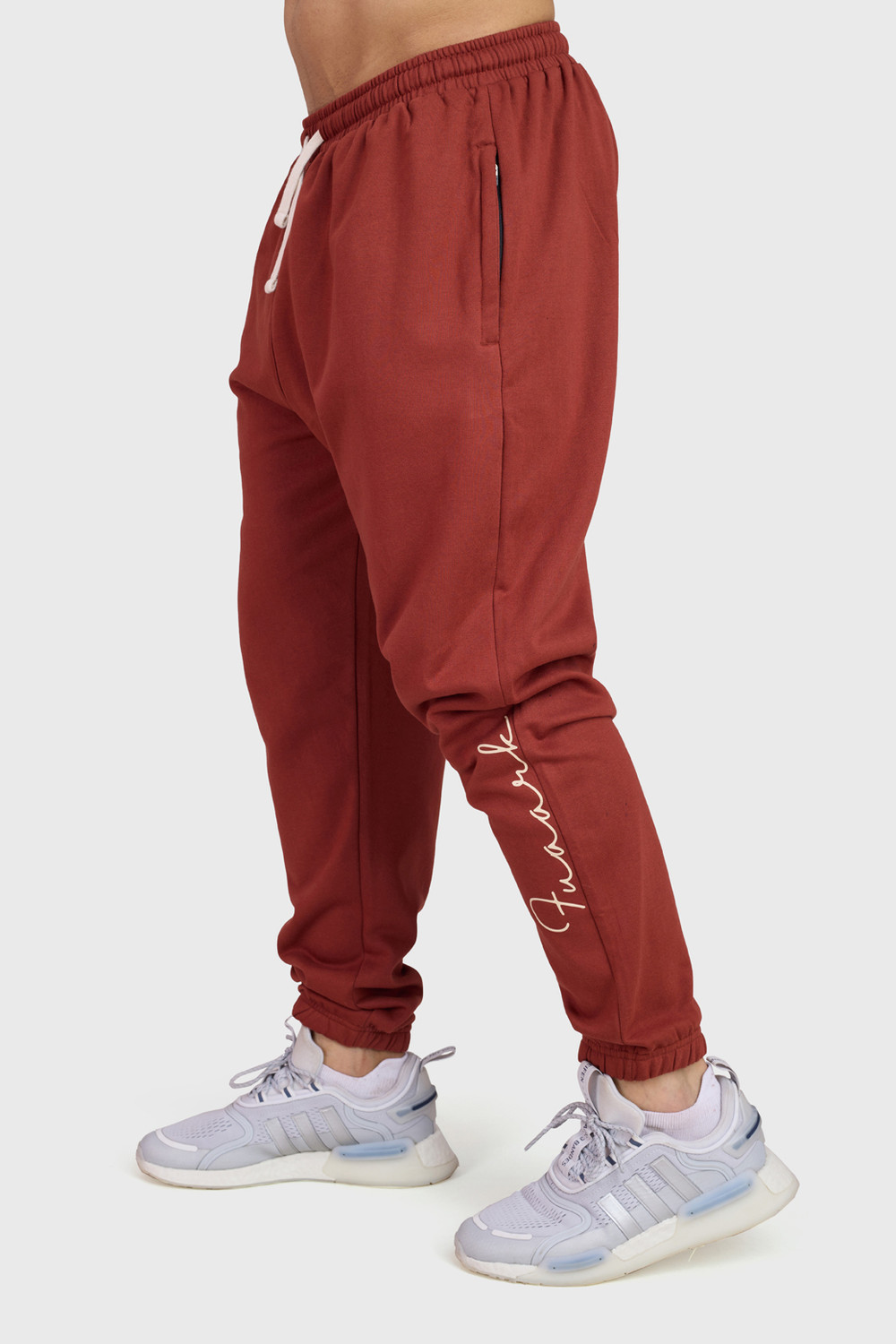 Image of FuaarK Solid Men Red Track Pants