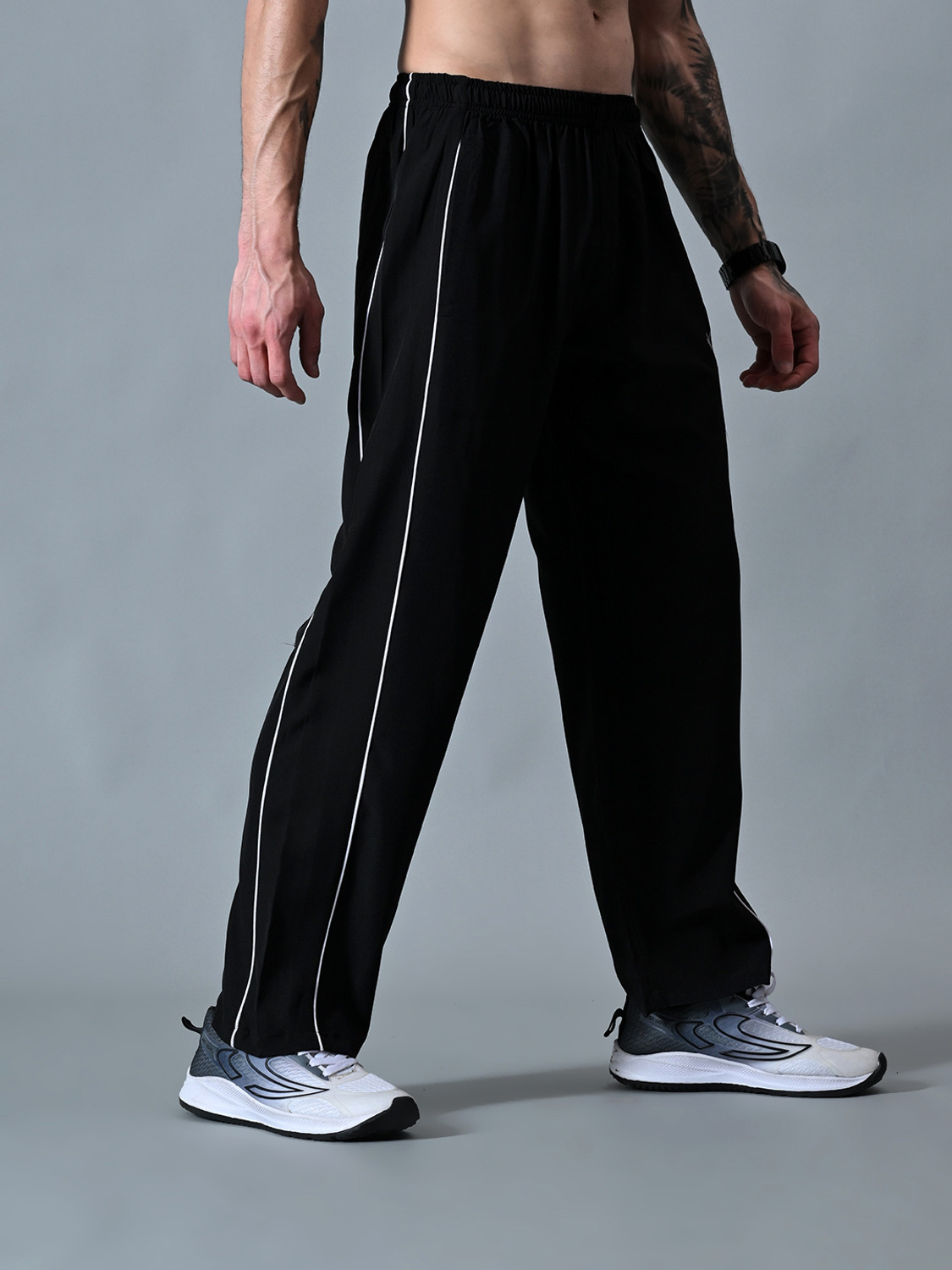 Image of HRX by Hrithik Roshan Striped Men Black Track Pants