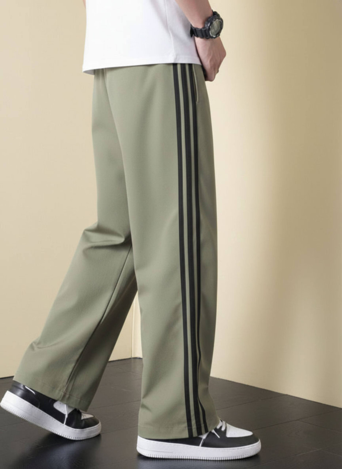 Image of LOTHRIC Striped Men Green Track Pants
