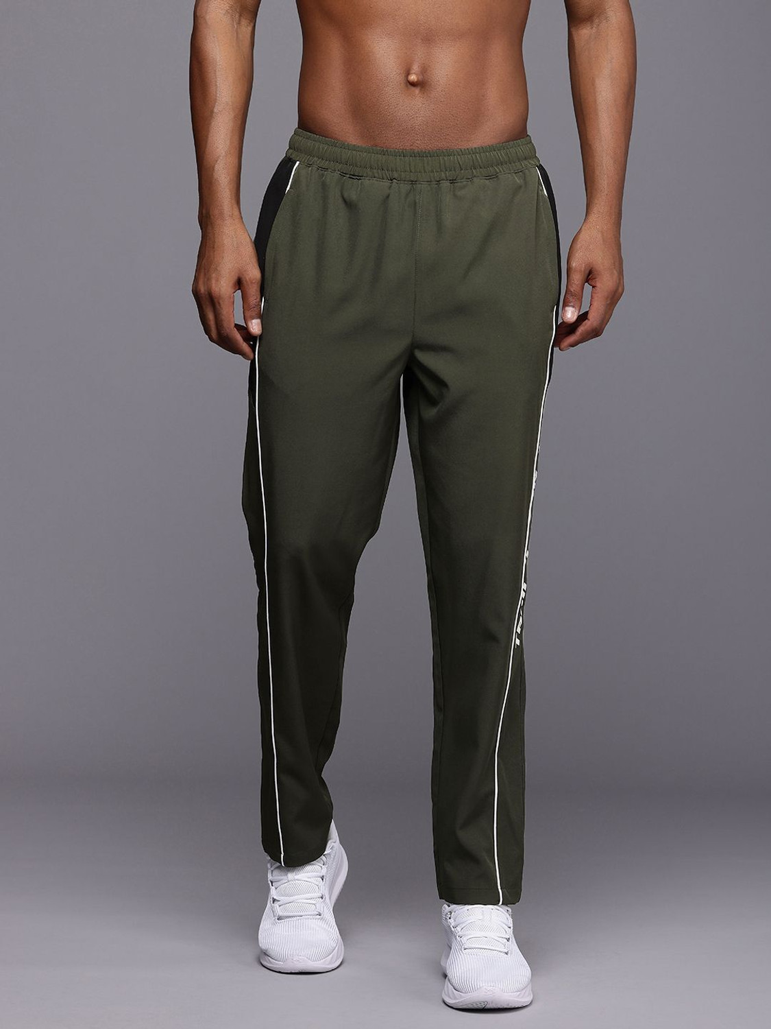Image of HRX by Hrithik Roshan Striped Men Green Track Pants