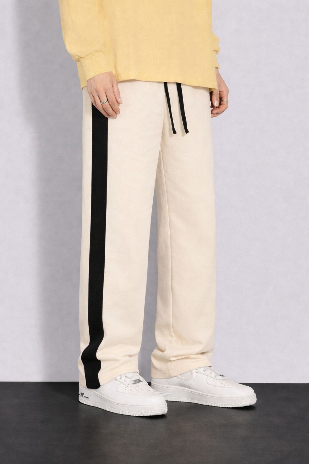 Image of COMBRAIDED Self Design Men Beige, Black Track Pants