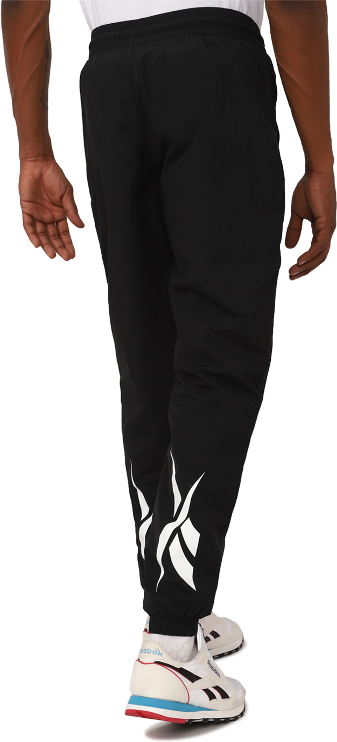 Image of REEBOK Solid Men Black Track Pants