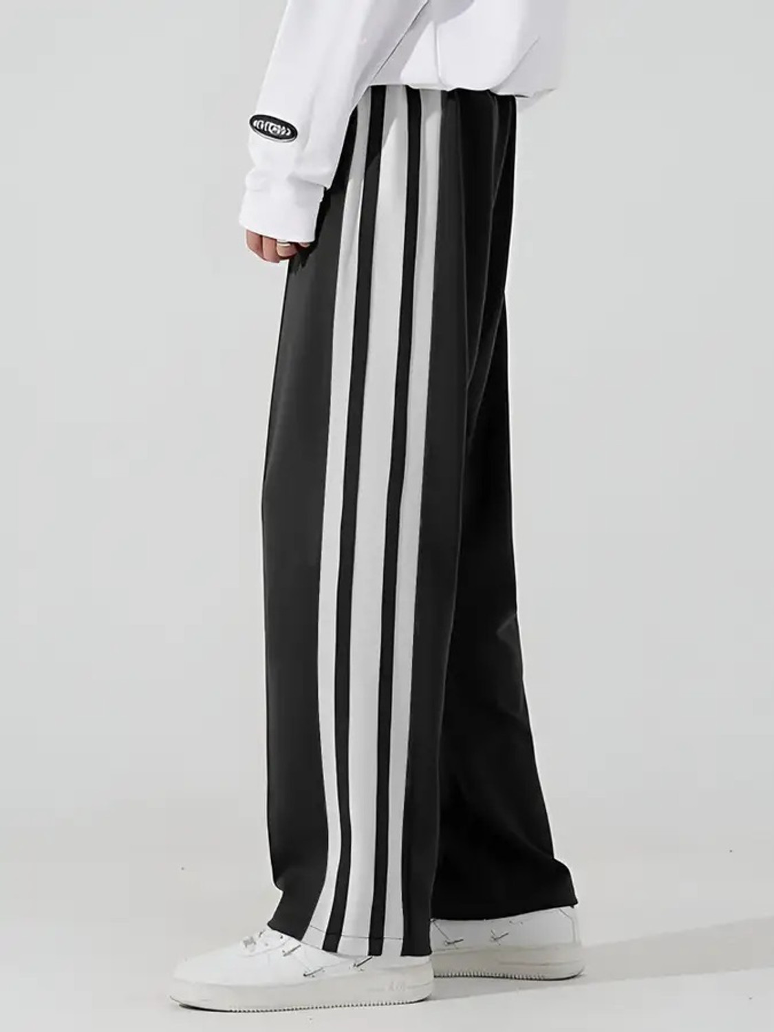 Image of Jump Cuts Striped Men Black Track Pants