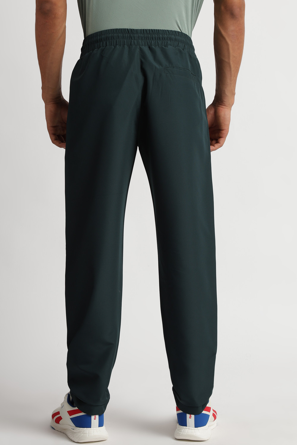 Image of REEBOK Solid Men Dark Green Track Pants