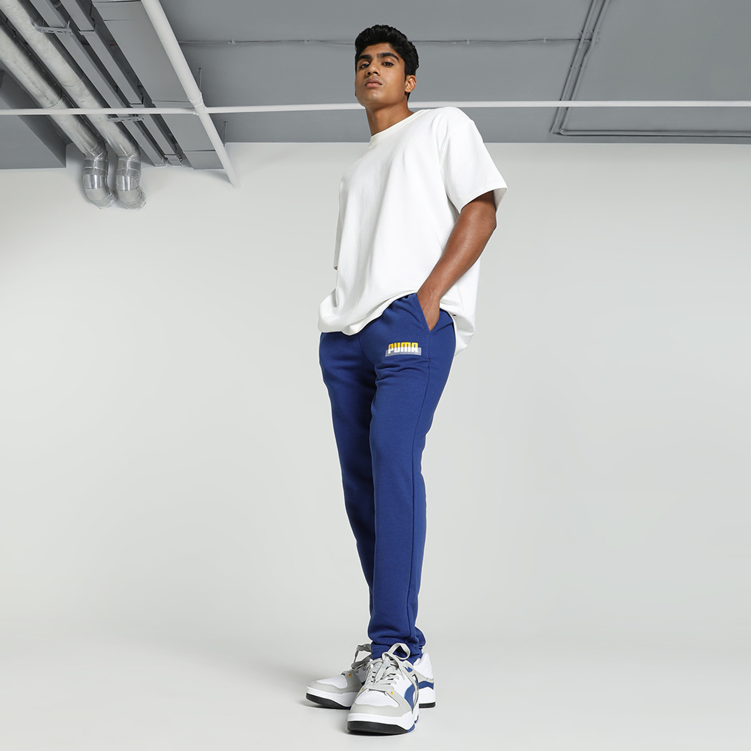Image of PUMA Solid Men Blue Track Pants