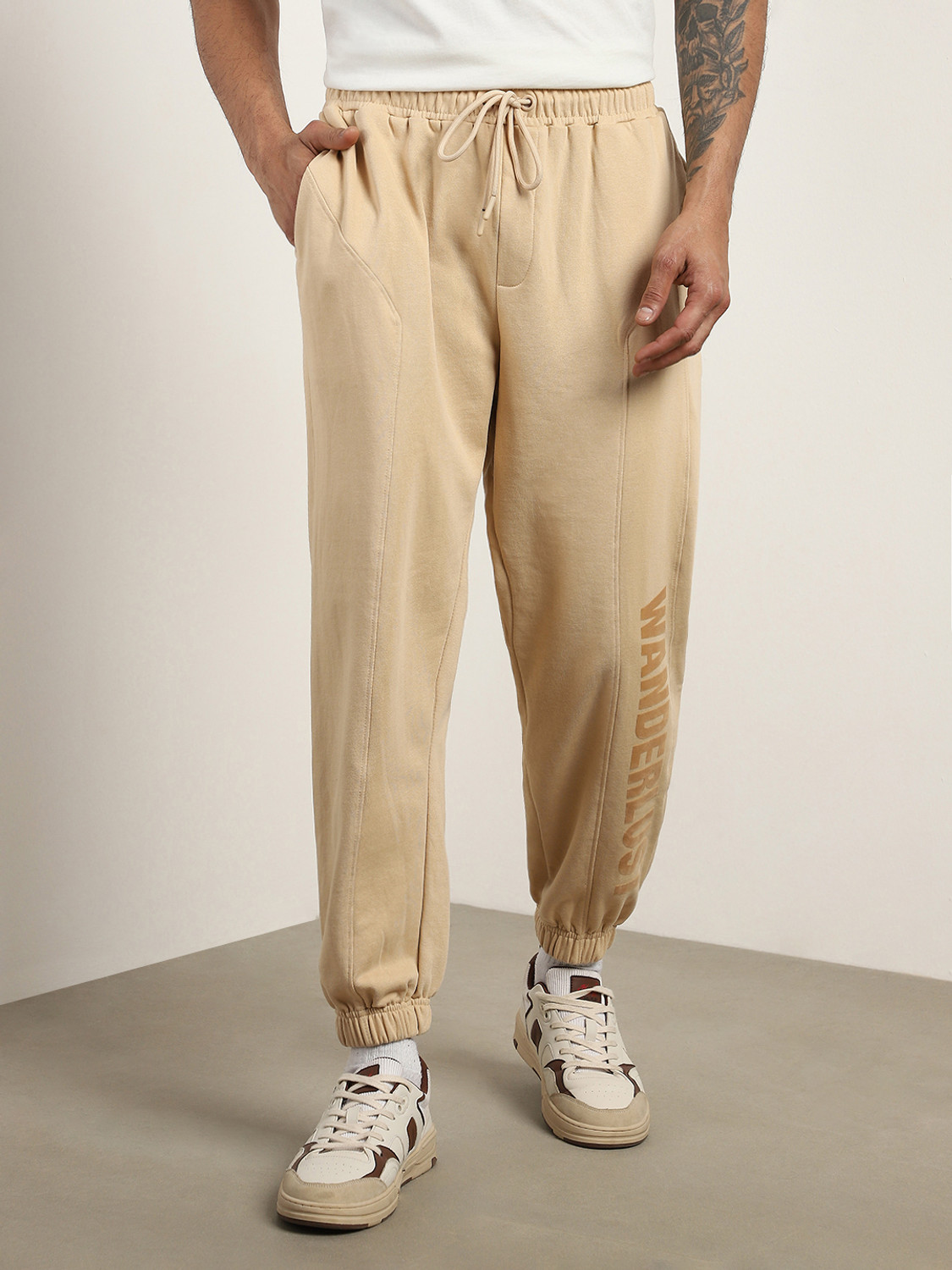 Image of NOBERO Printed Men Beige Track Pants