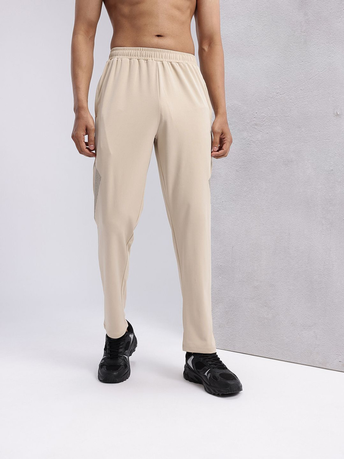 Image of HRX by Hrithik Roshan Graphic Print Men Beige Track Pants