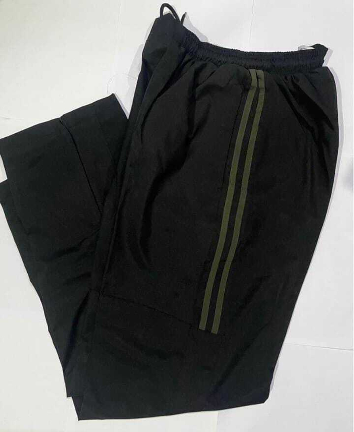 Image of army apparel Solid Men & Women Track Suit