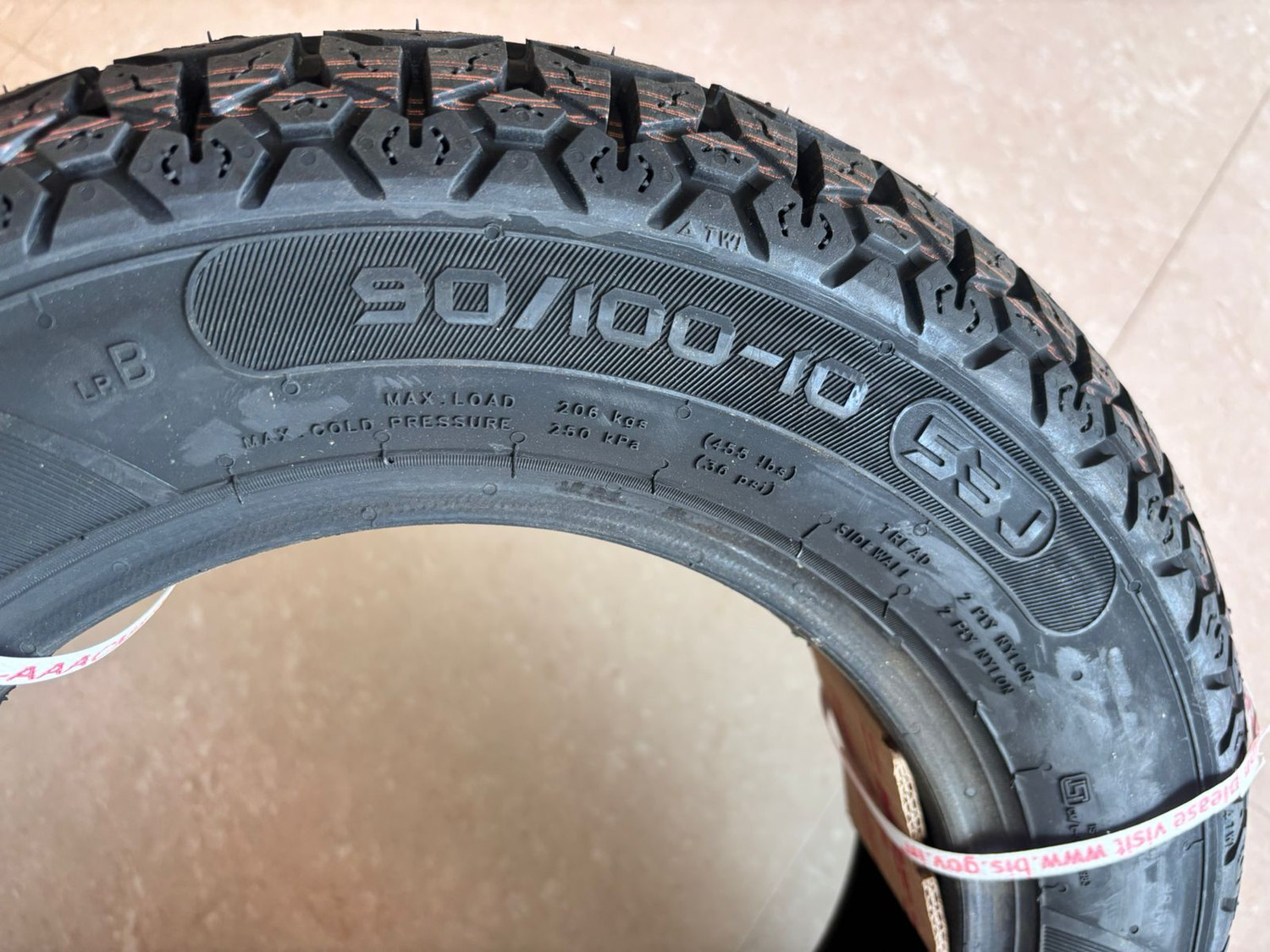 Image of MRF 90 /100-10 53J NYLOGRIP PLUS TUBELESS TYRES 90 /100-10 53J NYLOGRIP PLUS TYRE Rear Two Wheeler Tyre