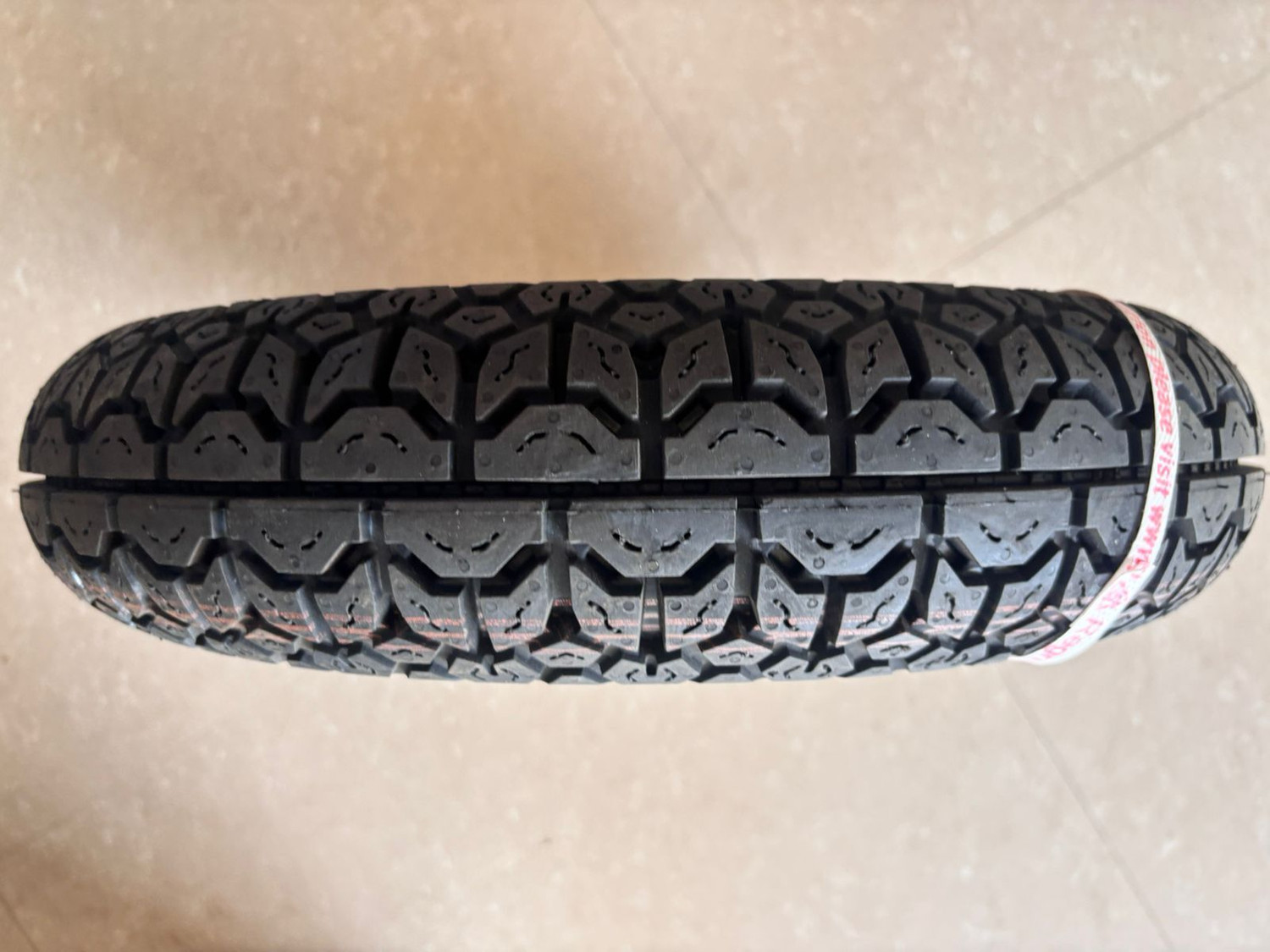 Image of MRF 90 /100-10 53J NYLOGRIP PLUS TUBELESS TYRES 90 /100-10 53J NYLOGRIP PLUS TYRE Rear Two Wheeler Tyre