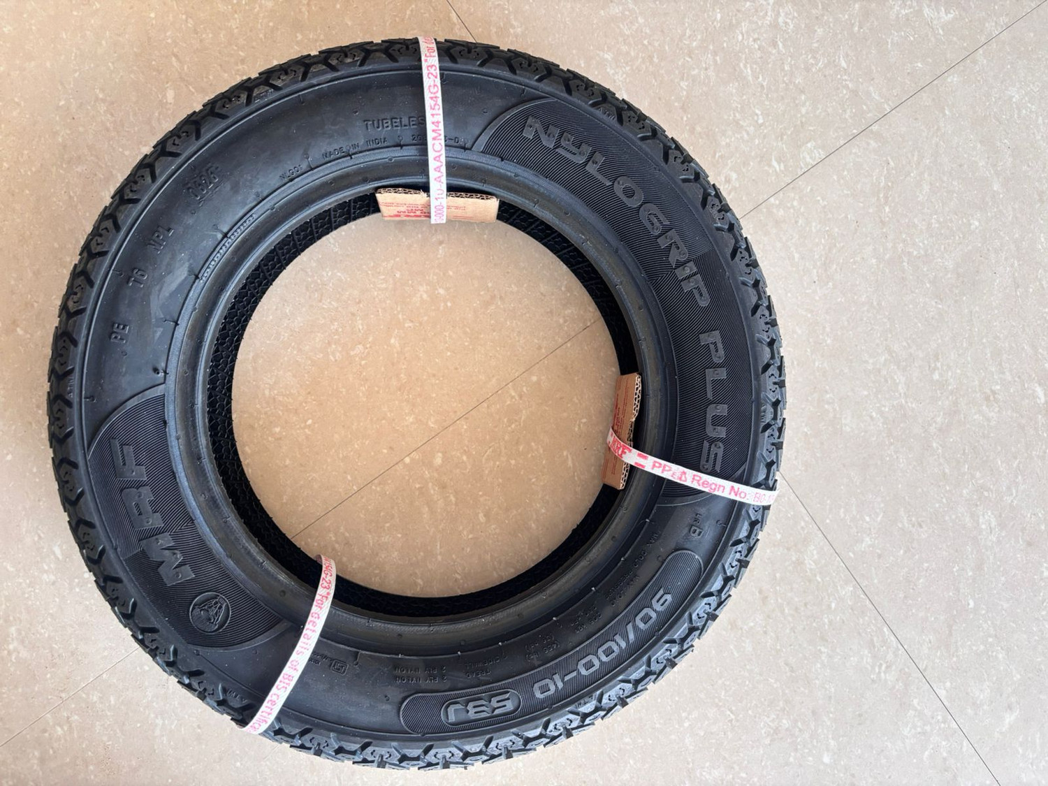 Image of MRF 90 /100-10 53J NYLOGRIP PLUS TUBELESS TYRES 90 /100-10 53J NYLOGRIP PLUS TYRE Rear Two Wheeler Tyre